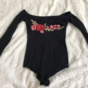 Black off the shoulder body suit. Rose embroidery